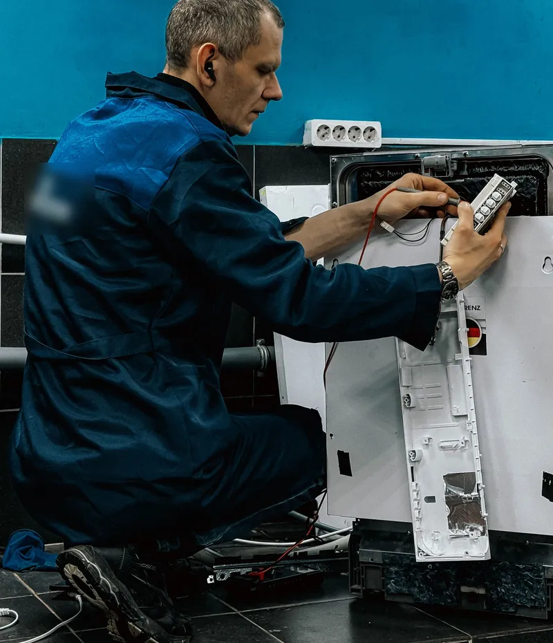 Visalia Appliance Repair Pros technician testing a dishwasher control panel